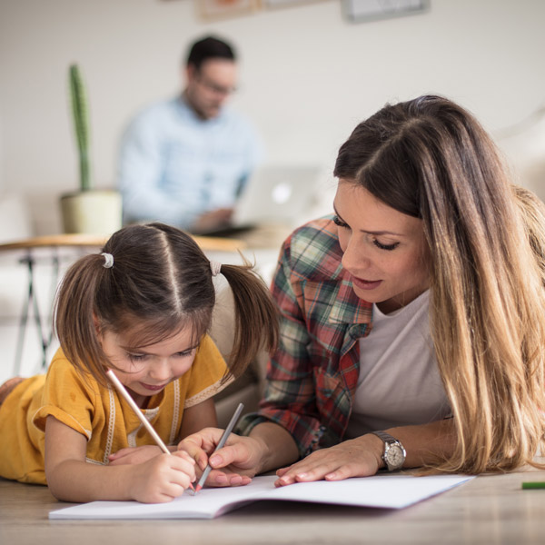 Mom helping daughter with homework