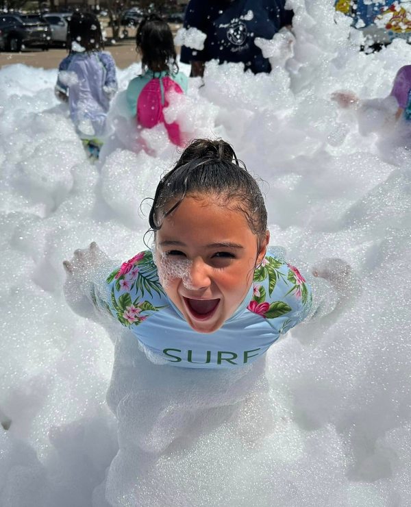 Students playing in bubbles 