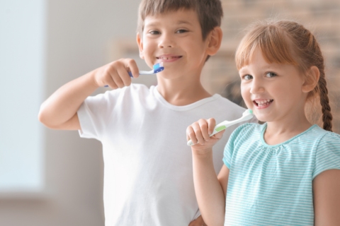 The Children's brushing their teeth.