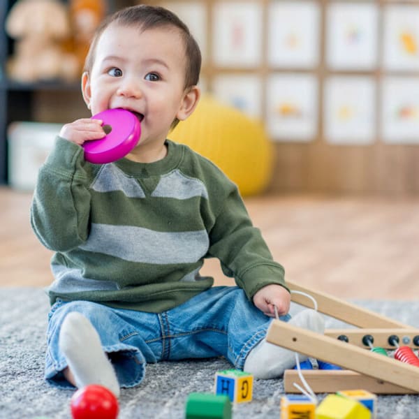 A small boy playing with toy